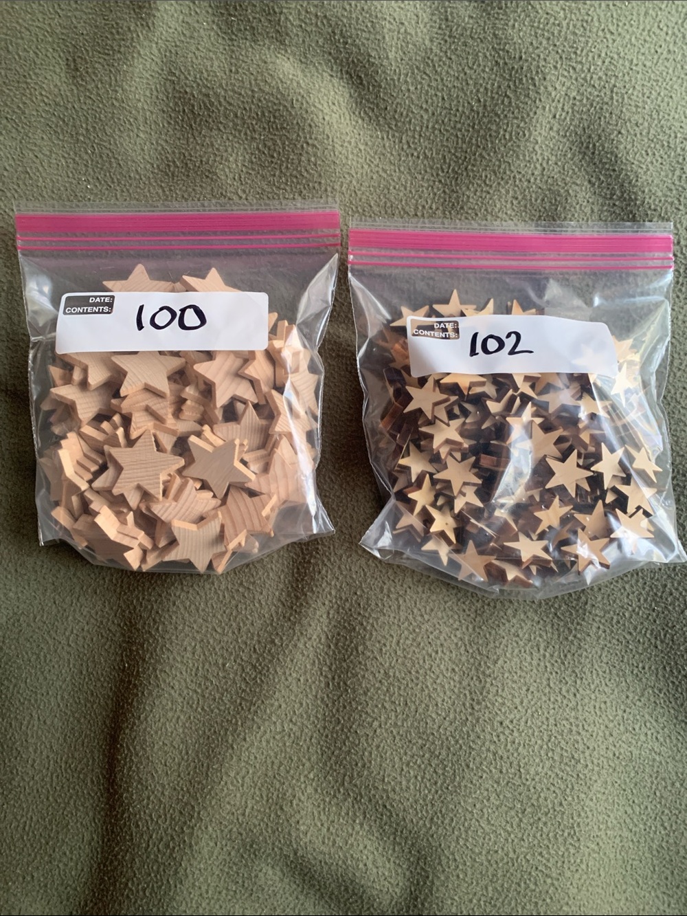 Lot of 2 unfinished wood star cutouts. 100- 1.5” and 102- 1”